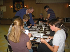 Volunteers stuffing bags with candidate material